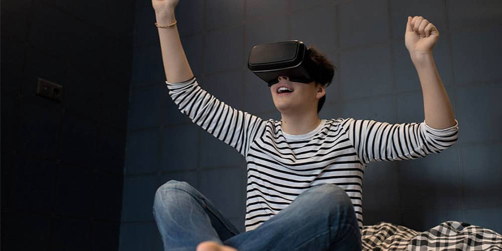 A boy wearing a VR headset